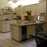Cozy kitchen with cream cabinets and a central island.