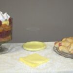 Desserts on table with trifle and pastries.