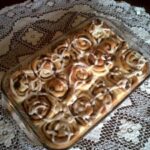 Cinnamon rolls in a glass baking dish.