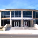 Modern building with large glass windows.