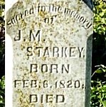 Old gravestone with engraved text.