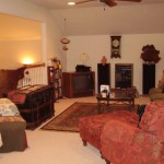 Cozy vintage living room with warm lighting and classic furniture.